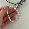 Baroque Pearl Bracelet Closeโup baroque pearl bracelet in hand for scale