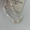 close-up baroque pearl necklace gold cone clasp