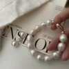 Close-Up of Baroque Pearl Bracelet - Large Mother-of-Pearl Beads lose-up view of a Baroque pearl bracelet featuring large mother-of-pearl beads and a gold-plated clasp.