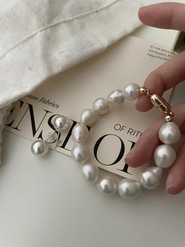 Close-Up of Baroque Pearl Bracelet - Large Mother-of-Pearl Beads lose-up view of a Baroque pearl bracelet featuring large mother-of-pearl beads and a gold-plated clasp.