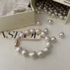 Baroque Pearl Bracelet with Packaging - Luxurious Gift Option Baroque pearl bracelet with large mother-of-pearl beads and gold-plated clasp displayed alongside its elegant packaging.