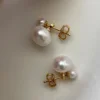 Close up of genuine freshwater pearl double stud earrings in 14K gold filled setting