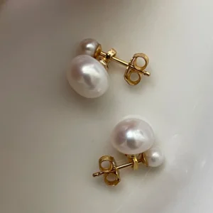Freshwater Pearl Double Stud Earrings Close Up Close up of genuine freshwater pearl double stud earrings in 14K gold filled setting