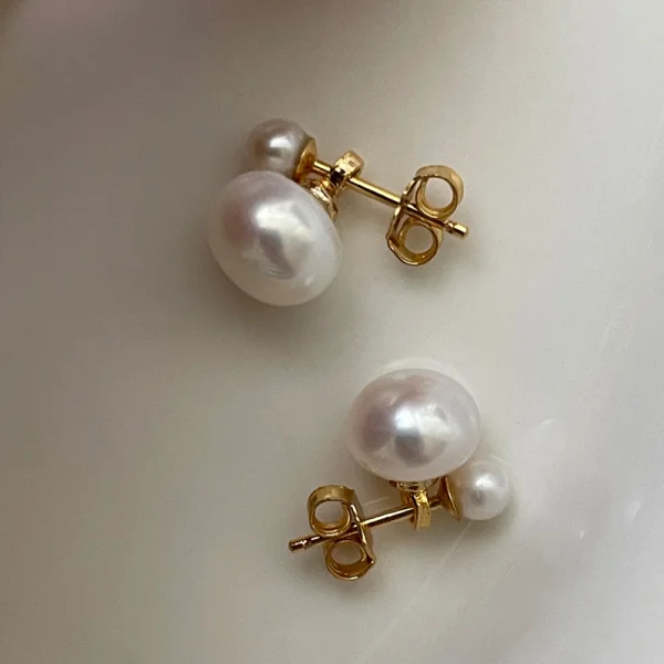 Close up of genuine freshwater pearl double stud earrings in 14K gold filled setting