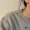 Model wearing dainty freshwater pearl stud earrings for everyday styling