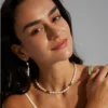 Model wearing green jasper necklace with baroque freshwater pearls