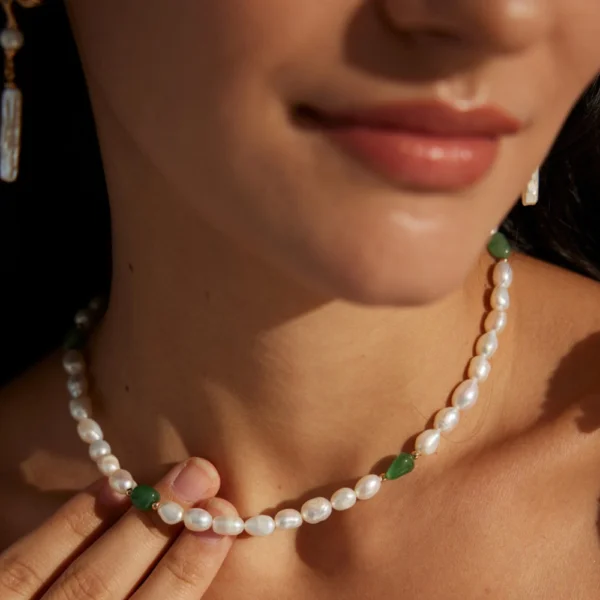 Close-up of green jasper pearl necklace worn as a delicate choker