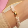 3.5-4.5mm mini freshwater pearl bracelet with gold magnetic clasp on wrist