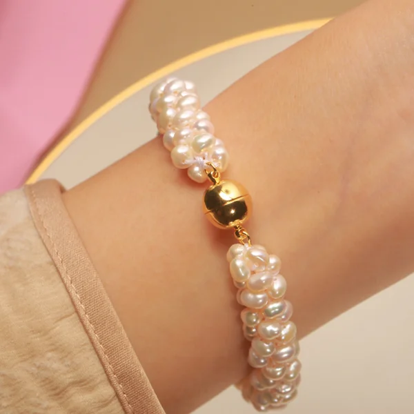 3.5-4.5mm mini freshwater pearl bracelet with gold magnetic clasp on wrist
