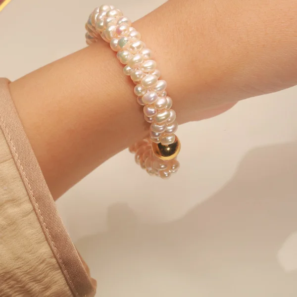 mini freshwater pearl bracelet worn, gold magnetic clasp