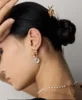 antique gold retro pearl drop earrings styled on model