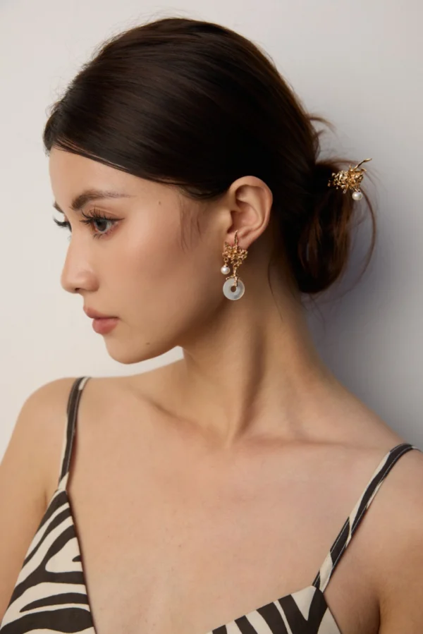 antique gold retro pearl earrings on model with mother-of-pearl charm