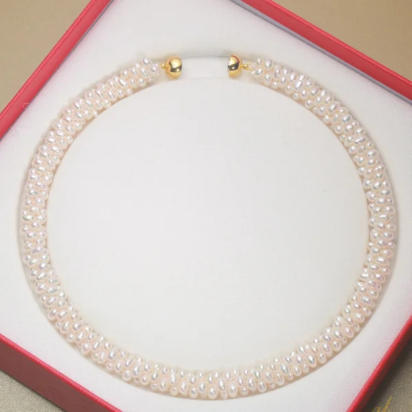 white freshwater pearl necklace in box with gold magnetic clasp