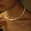 White Pearl Twist Necklace on Model white freshwater pearl twist braided necklace worn at collarbone