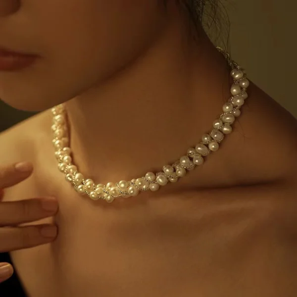 White Pearl Twist Necklace on Model white freshwater pearl twist braided necklace worn at collarbone