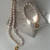 baroque pearl bracelet and matching necklace with gold coin charms
