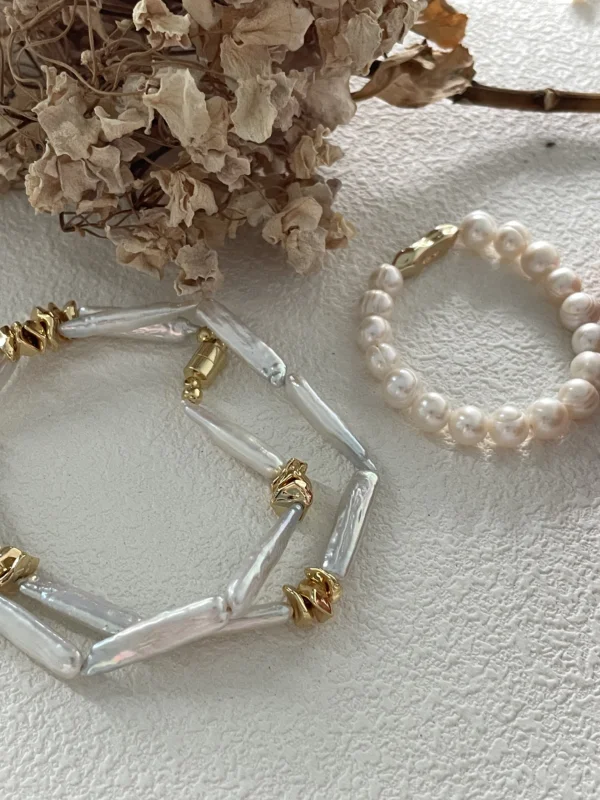 baroque freshwater pearl bracelet stacked with gold accents