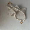 freshwater druzy rosebud pearl necklace with adjustable extender and gold coin charm