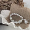 Baroque freshwater pearl bracelet styled on linen with natural texture