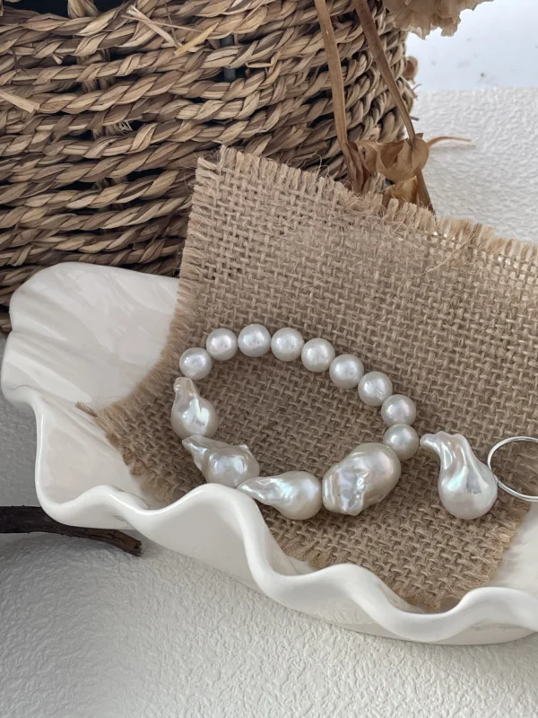 Baroque freshwater pearl bracelet styled on linen with natural texture