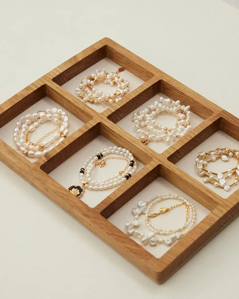 Freshwater pearl jewelry collection displayed in a wooden tray for everyday wear