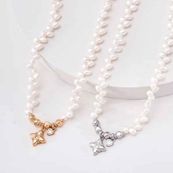 Freshwater pearl necklace with CZ charms in polished silver and gold-plated finishes