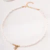 Gold-plated freshwater pearl necklace with 3–4mm pearls and CZ charms