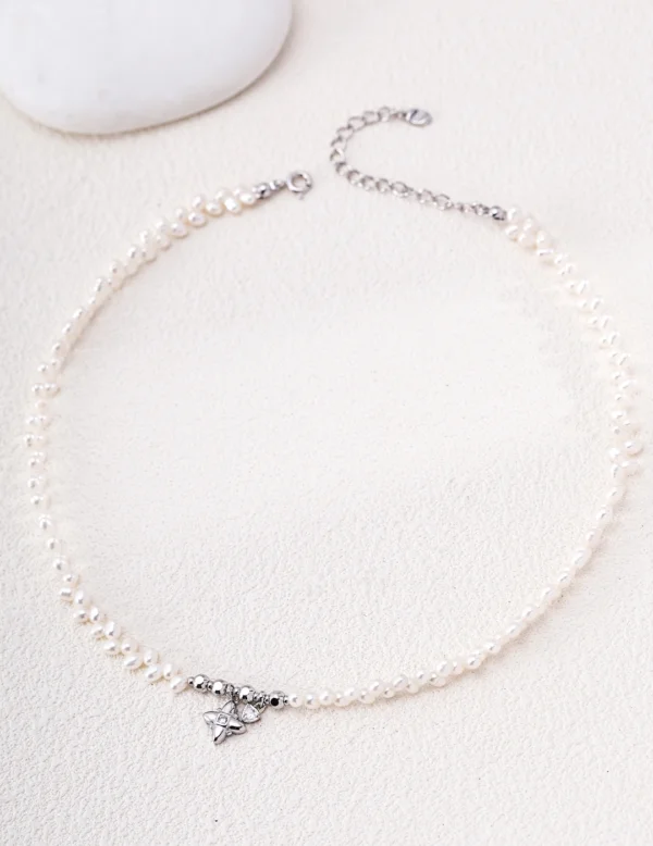 Polished sterling silver freshwater pearl necklace with adjustable extender chain and CZ charms