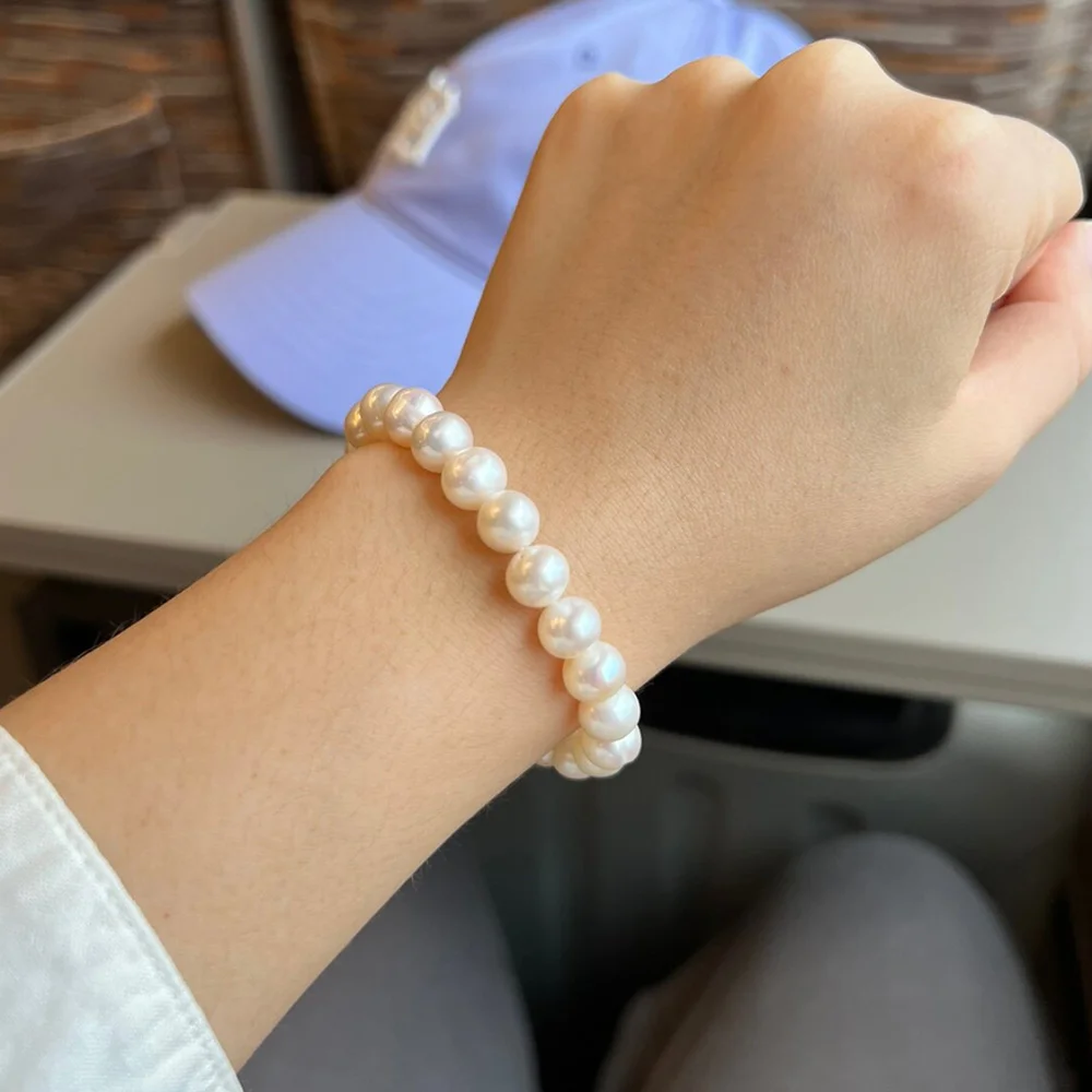 7mm white pearl bracelet worn on the wrist