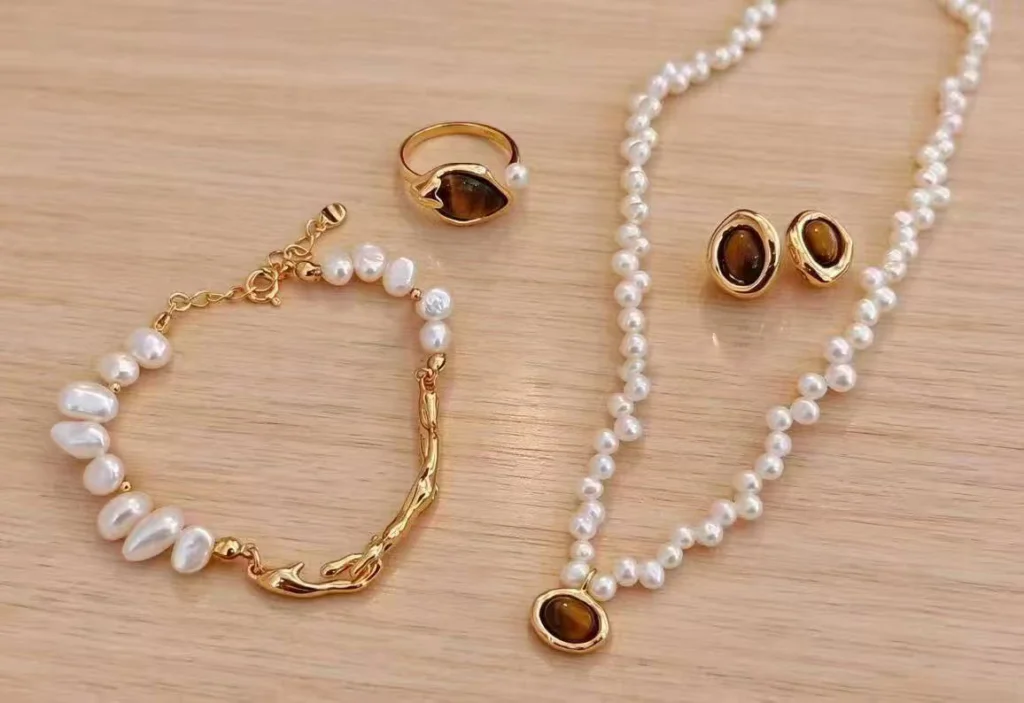 mixed-metal pearl jewelry with gold and silver chain details