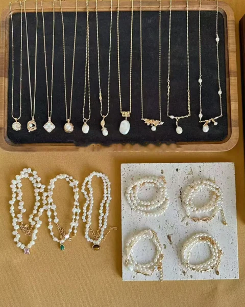 Pearl necklaces and bracelets showing different pearl sizes for jewelry guide