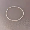 White Freshwater Pearl Necklace Flat Lay White 5.5–6mm near-round freshwater pearl necklace arranged in a circle